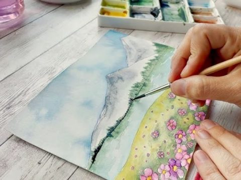 Artist creating watercolor painting on smooth bamboo paper with vibrant colors and clean brush strokes