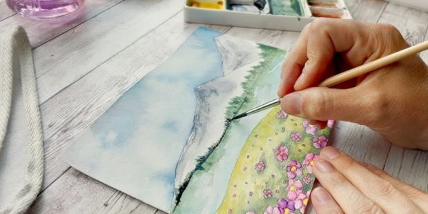 Artist creating watercolor painting on smooth bamboo paper with vibrant colors and clean brush strokes