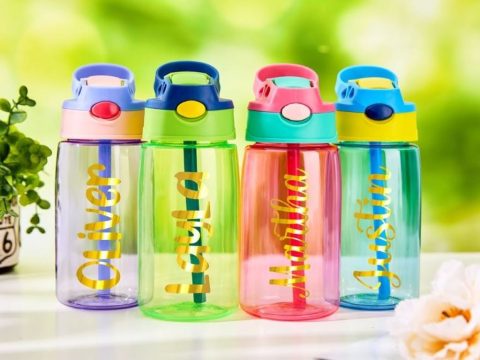 Colorful personalized water bottles with children's names for 8th birthday party favors