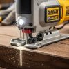 DEWALT 20V MAX XR jig saw cutting through hardwood with precision and LED light illuminating the blade path