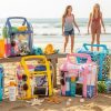 teen carrying waterproof beach bag on summer beach trip