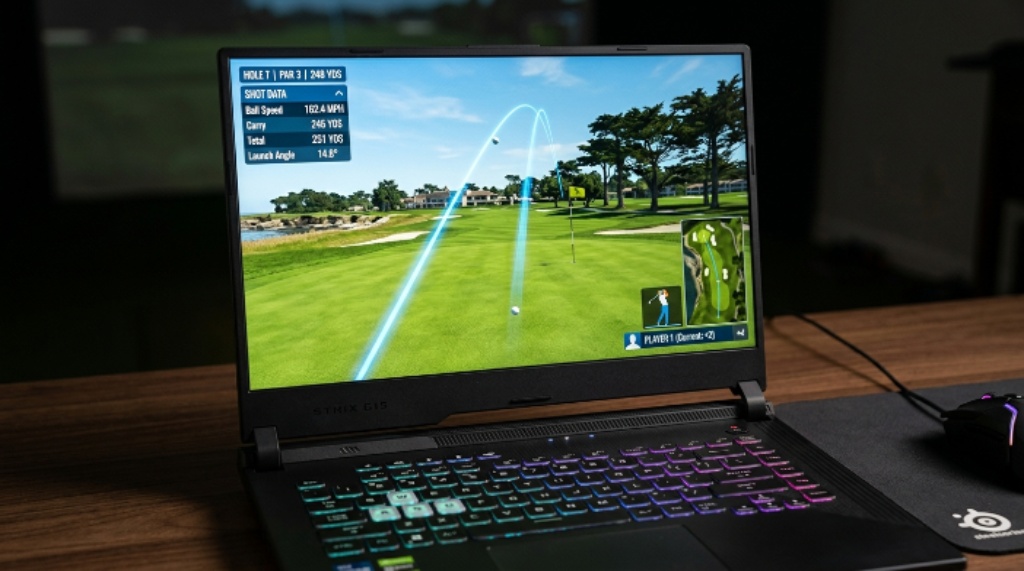 Close-up of a high performance gaming laptop screen showing a golf simulator ball flight path on a virtual fairway