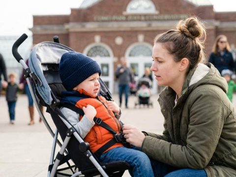 Parent calmly helping toddler through emotional meltdown