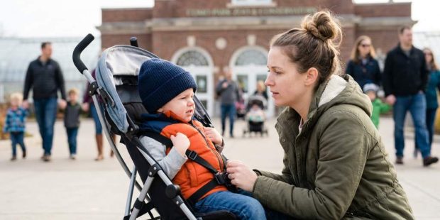 Parent calmly helping toddler through emotional meltdown