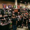 Horror convention vendor hall filled with Halloween-themed merchandise