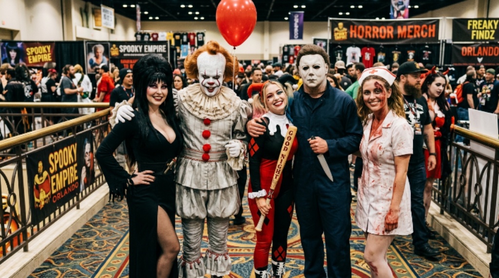 Costumed fans posing together at a Florida horror convention