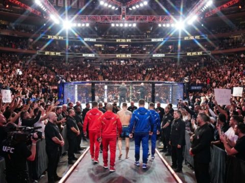 UFC fighters entering the octagon at a packed Madison Square Garden in New York City during a November numbered event